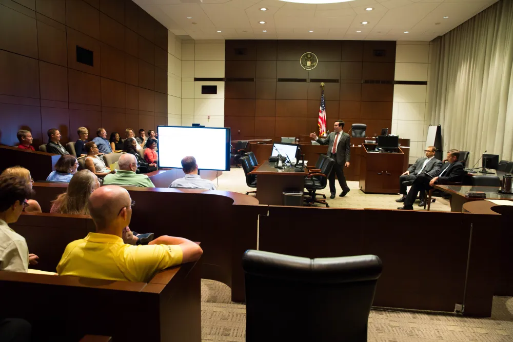 Assistant U.S. Attorney Richard Finneran lectures school teachers about financial fraud prosecutions. 