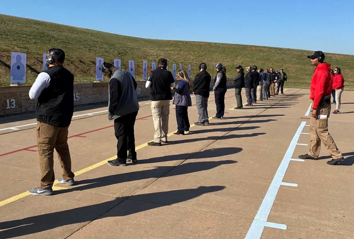 Probation and pretrial services officers receive firearms instruction.